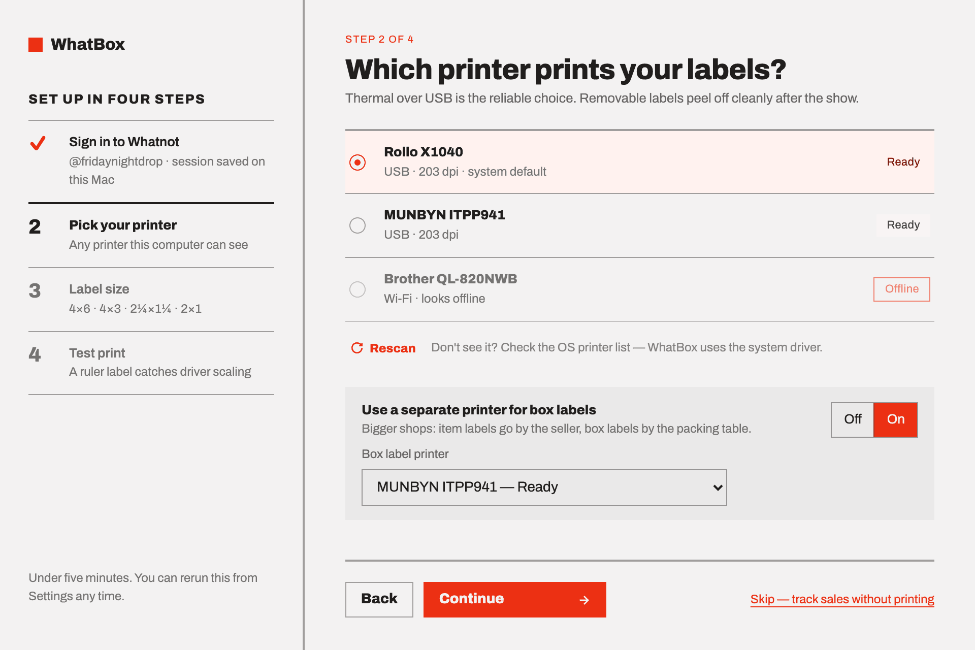The onboarding wizard on step two, picking a printer from a list showing which are ready and which are offline, with an option to send box labels to a second printer.